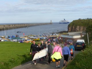 Devil's Elbow carrying their boat up the hill